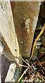 NY5343 : Benchmark on stone gatepost at access track to Highfield by Luke Shaw