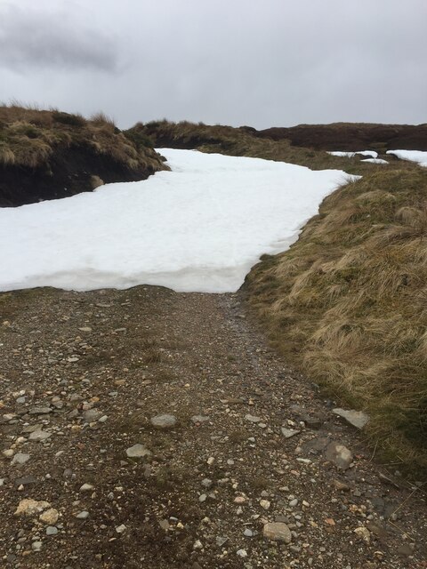 Tough deep patch of remaining snow on track to Carn Dubh Ic An Deoir