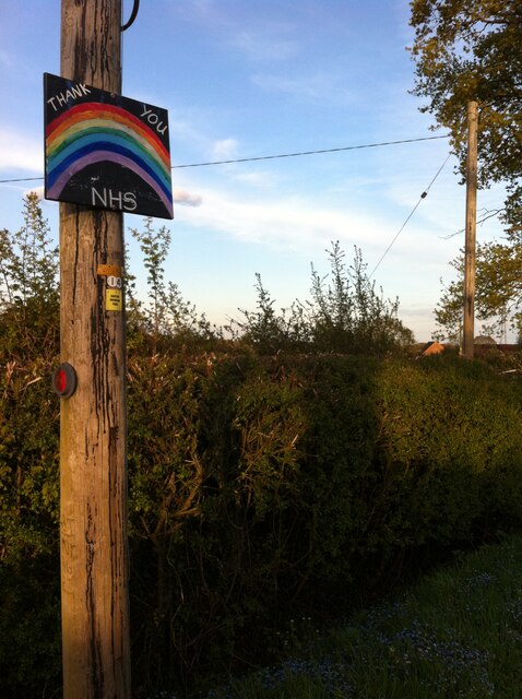 NHS rainbow sign affixed to telegraph pole, Clay Lane