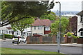 View down Ankerdine Crescent, with distant view of the River Thames