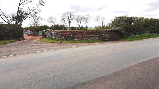 Parapet of bridge over Alstonby Beck and entrance to Alstonby Villa