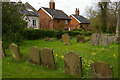 TM2972 : Laxfield: houses on Church Walk, from the churchyard by Christopher Hilton