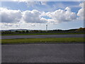 A48 and wind turbine from Hollol Gymraeg services