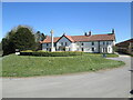 War  memorial  on  Cross  Green.  Ludhill  Farm  behind