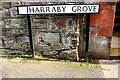 Benchmark on the Harraby Grove face of the Harraby Pub