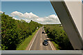 SS5331 : Looking east up the A39 from a cycle/foot bridge at Roundswell by Roger A Smith
