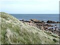 NK1248 : Rocky shoreline at Craigewan by Oliver Dixon