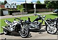 Motorbikes parked by Sedlescombe Village Green