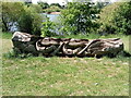 View of a wood carving of rowers in Mayesbrook Park