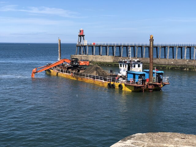 Dredger at work in the harbour mouth