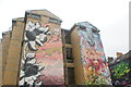 View of street art on the side of the Station House hostel on Code Street from Pedley Street