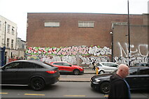 TQ3482 : View of street art on the front of a large brick building on Bethnal Green Road by Robert Lamb