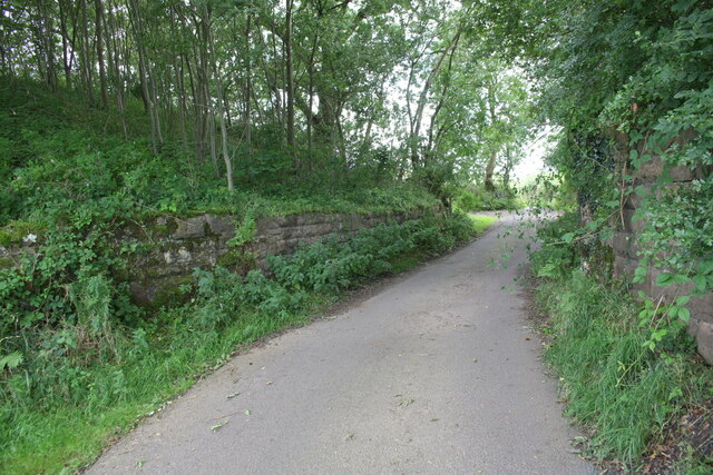 Minor road north of Waitby passing abutments of bridge of dismantled railway