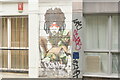 View of street art on the front of a block of flats on Cheshire Street