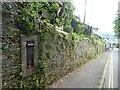 Blocked off postbox in wall, edge of Kingswear