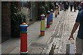 View of brightly painted bollards on Floral Street #6