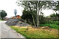 Pile of grit beside track heading south at Appleside Farm