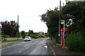 Bus stop and telephone box on Gretton  Road, Gotherington