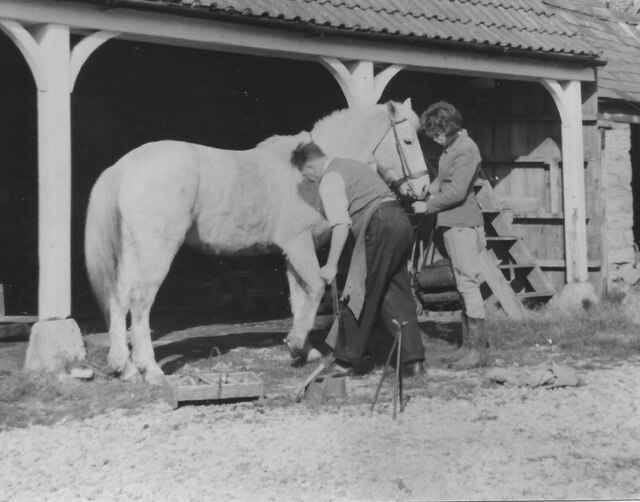 Travelling farrier shoeing pony, Marston, Oxford, 1957