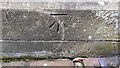 NY3561 : Benchmark on tower of St Mary the Virgin Church by Roger Templeman
