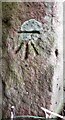 Benchmark on gatepost at field gateway on SW side of Peter Gate