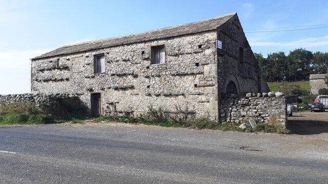 Barn on NW side of A684 at Field Gate Farm