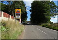 Approaching level crossing on the A706, Cleghorn