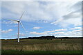 NS9557 : Wind turbine near disused quarry by JThomas