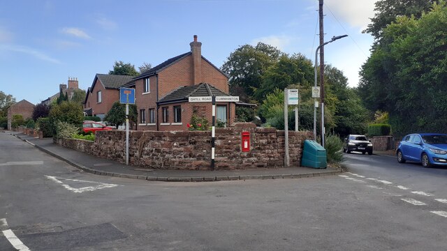 Road junction and bus stop in Scotby