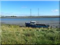TQ9168 : Derelict boat on The Swale by Marathon