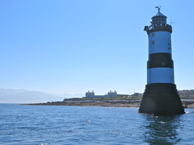 Goleudy Trwyn Du, Ynys MÃ´n From the sea, the lighthouse and keepers&amp;#039; cottages at the far point of Anglesey, beyond Penmon. The island is famous for the vibrant quaity of its light.