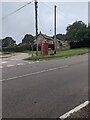 Red phonebox between poles, Cobblers Plain, Monmouthshire