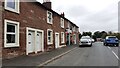 Houses and post office on west side of Scotby Road