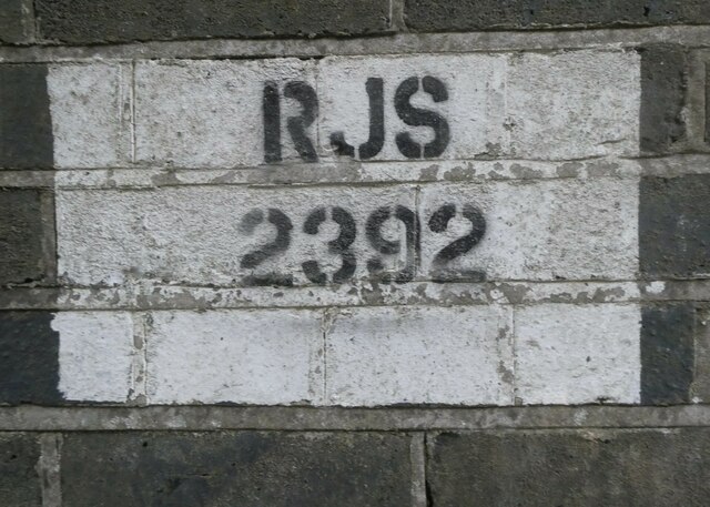 Railway marking on a former bridge