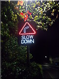 TF1505 : Illuminated slow down sign on High Street, Glinton by Paul Bryan