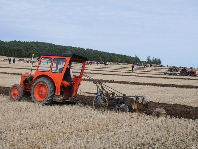 Case tractor and trailed plough at Mindrum Mill