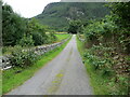 Wall-lined minor road near to Croftown