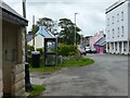 Bus shelter, telephone box, Globe Hotel and the B4320, Angle, Pembrokeshire