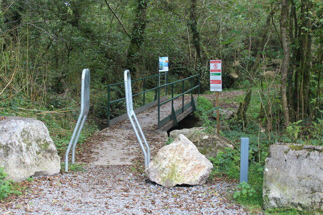 Squeeze stile to footbridge over stream