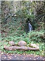 Waterfall and seat by Tarka Trail opposite Weare Barton