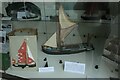 View of a model of a Thames barge in the Waterfront Window Museum