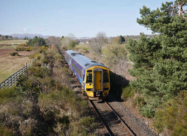 Train passing Muir of Ord