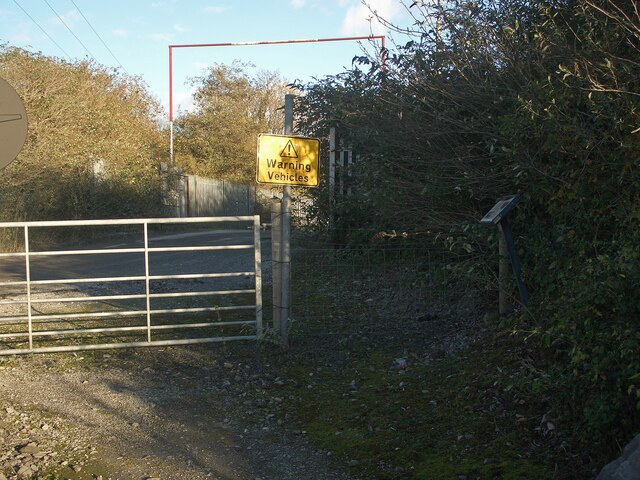 Warning sign and information board on public footpath near Cornelly Quarry