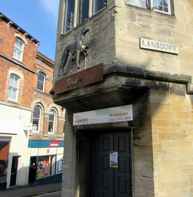 Greyhound depiction on a town centre corner, Stroud