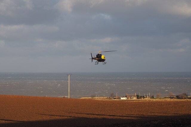 Helicopter examining Power Lines at Birnieknowes