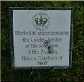 Plaque on a tree in the field behind Pear Tree Road