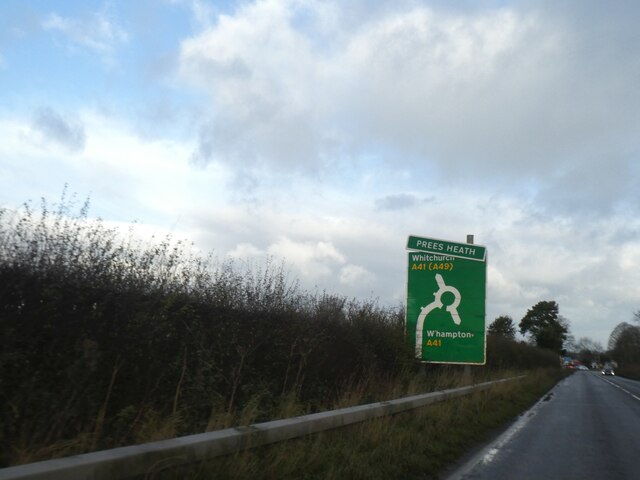 Advance sign (damaged) for roundabout at Prees Heath