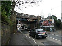 TQ0159 : Car passing under a railway bridge in Monument Road by Basher Eyre