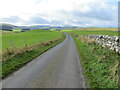 NT4709 : Wall and fence enclosed minor road near to Auld Ca-knowe by Peter Wood