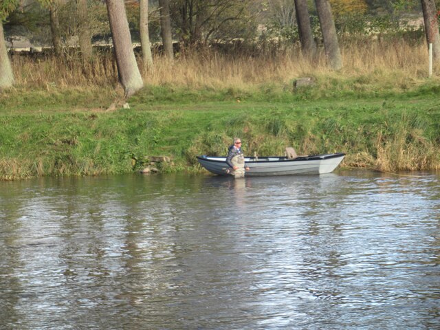 Fisherman waist deep in the River Tweed